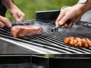 Colorful spread of top 10 vegetarian BBQ dishes on rustic table grilled veggie skewers, portobello burgers, corn, halloumi, and fresh salads. Outdoor summer setting.